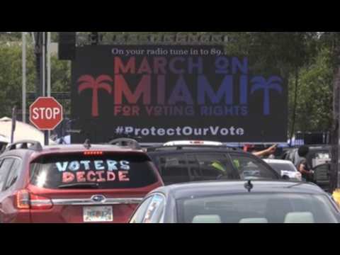Protesters in Miami participate in march for voting rights