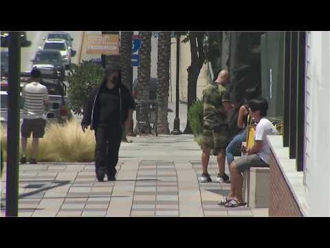 People in Burbank, California wear masks despite covid-19 regulations easing