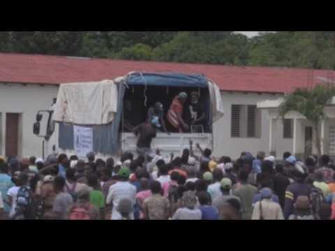 Trucks loaded with food aid to Haiti earthquake victims looted