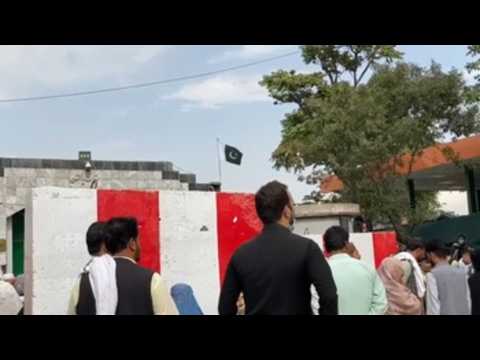 Afghans crowd the Pakistani embassy to apply for visas