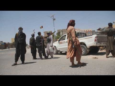 Afghan security officials patrol Herat after they took back control of parts of city