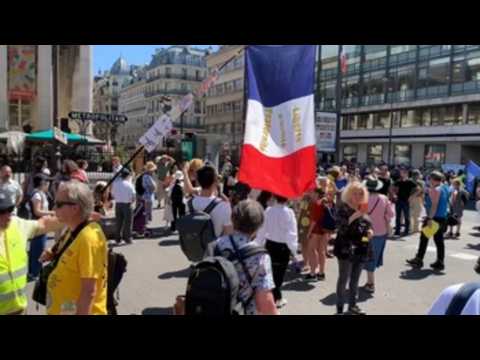 Thousands protest in France against health pass