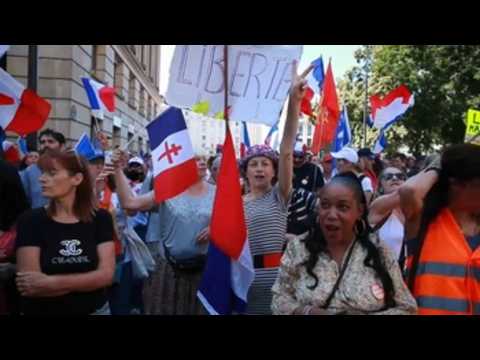 Thousands protest in France against health pass