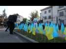 Activists protest with Ukrainian flags in front of the Russian embassy in Kyiv