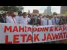 Malaysian opposition members of Parliament hold protest, demand PM resignation