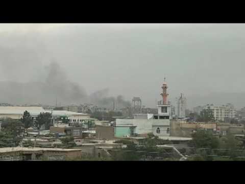 Smoke near Kabul airport after rockets heard flying over capital