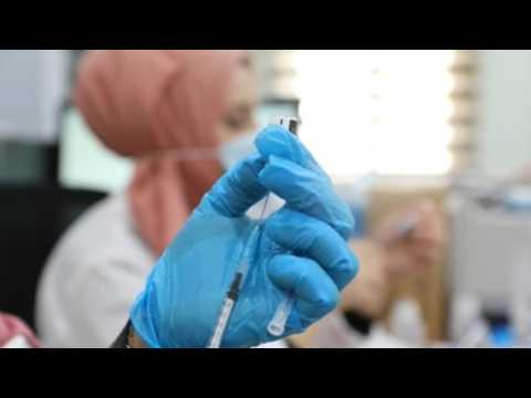 Students receive coronavirus vaccine in West Bank