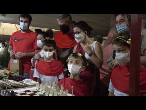 Romans wearing masks to celebrate the founding of Mérida