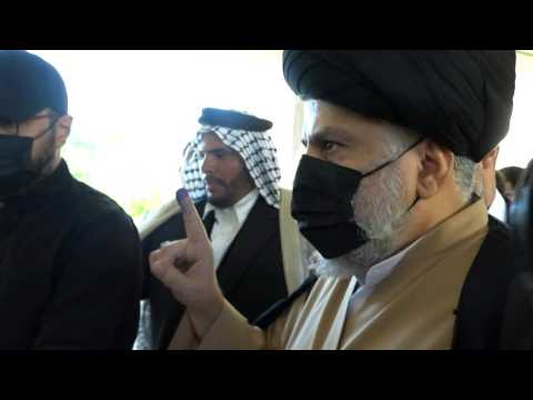Iraqi Shiite cleric Moqtada al-Sadr casts his ballot as polls open in Najaf