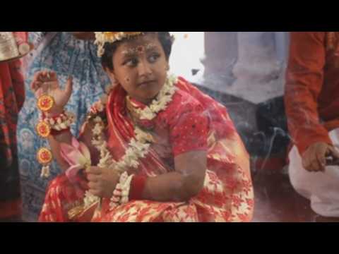 Hindu devotees perform Kumari Puja rituals as part of Durga Puja festival