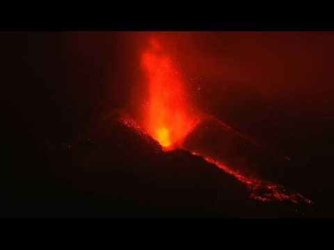 Lava erupts from Cumbre Vieja volcano at night in La Palma