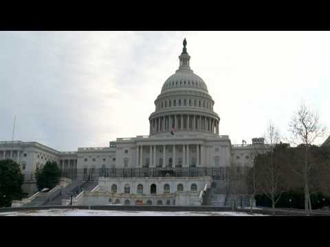 Police stand guard at US Capitol on morning of Jan 6 riot anniversary
