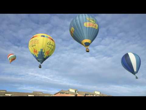 Hot air balloons colour the Mondovi sky in Italy