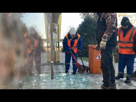 In Kazakhstan's largest city, workers clean up debris after violent clashes