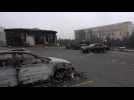 Burnt-out cars and administrative buildings in central Almaty