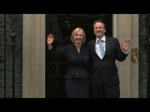 New UK PM Liz Truss enters 10 Downing Street with husband
