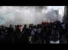 Protesters and riot police clash in Santiago de Chile