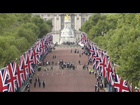 Scenes outside Buckingham Palace as crowds wait for procession of the Queen's coffin