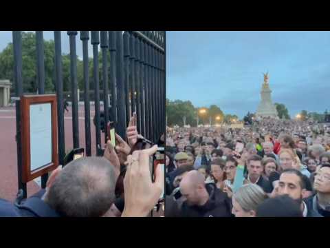 Large crowd outside Buckingham Palace as official notice of Queen Elizabeth's death is displayed