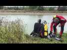Plongeurs à la recherche d'un corps dans le canal du Nord