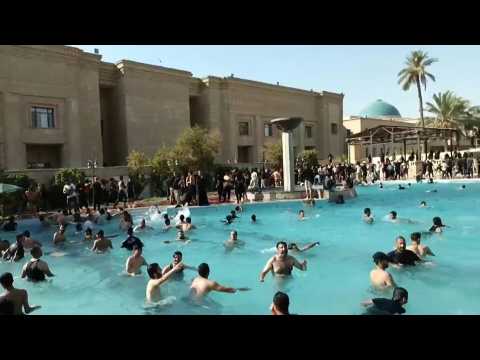 Iraq's Sadr supporters cool off in Baghdad government building pool