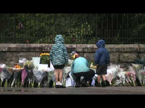 People lay flowers in front of Balmoral Castle after Elizabeth II's death
