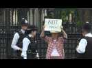 Protester lead away for 'Not My King' sign outside Parliament - Label : AFPTV - First images - Category : News
