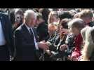 King Charles III and Prince William shake hands on South Bank