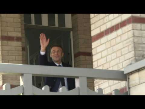 Macron, wife Brigitte return home after voting in first round of presidential election