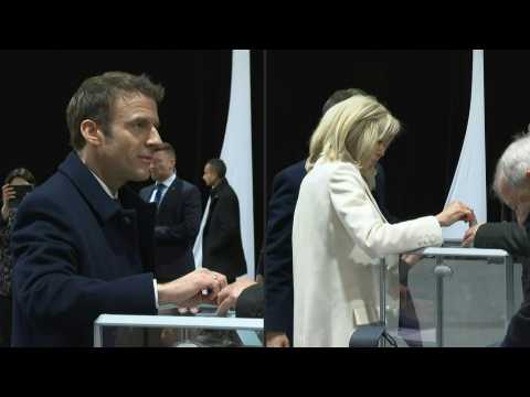 Macron, wife Brigitte vote in first round of presidential election