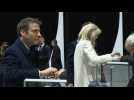 Macron, wife Brigitte vote in first round of presidential election