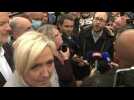 French elections: Le Pen challenged by Macron party activist during campaign trip