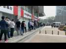 Beijing residents queue for mass Covid testing as cases spike