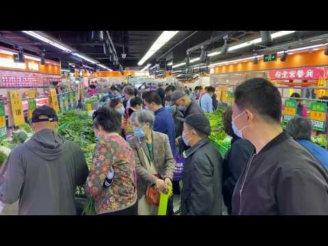 Beijing residents rush for groceries as Covid cases rise