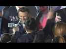 Emmanuel Macron greets supporters after victory speech