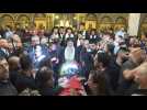 Palestinian mourners carry coffin of slain Al Jazeera journalist into Jerusalem church