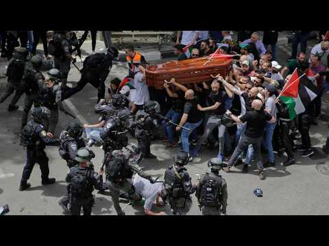 Israel police beat pallbearers at Al Jazeera journalists's funeral
