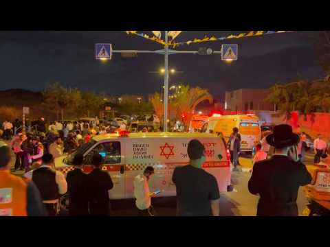 Crowd gather on site of attack that killed at least three in central Israel