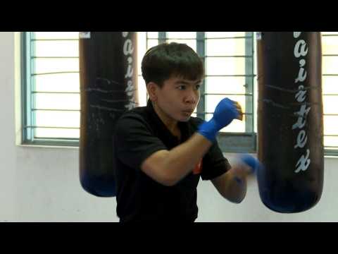 Boxer battles poverty, misogyny to become Vietnam's first world champion