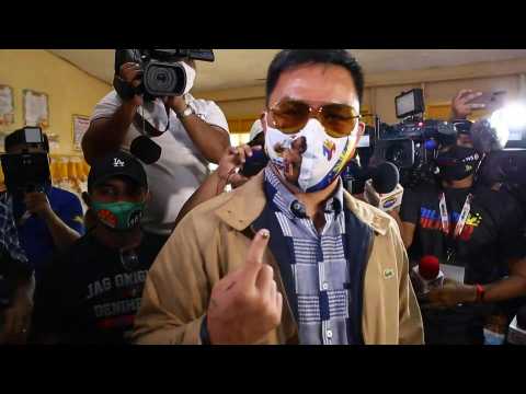 Filipino boxing legend and presidential candidate Manny Pacquiao casts vote