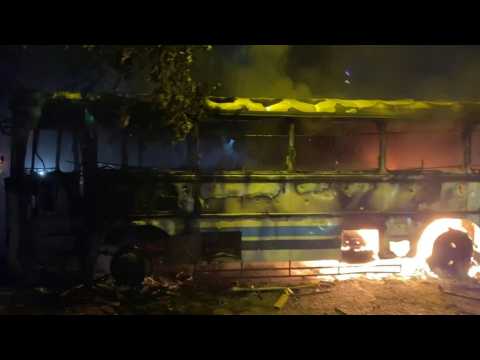 Buses torched outside former PM's residence in Sri Lanka violence