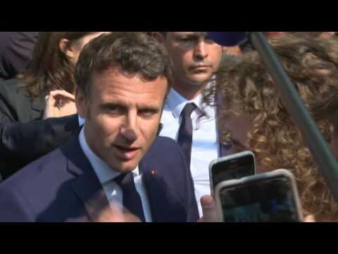 Macron on first outing since re-election in town near Paris