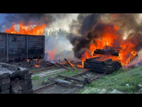 Railroad car engulfed in flames after shelling in Lyman, Ukraine