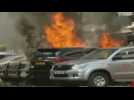 Car burns near Uganda parliament after explosion in Kampala