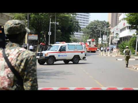 Police and emergency crews at the scene of suicide bombings in Uganda