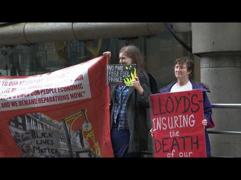 Environmental activists protest outside Lloyd's of London for role insuring coal projects