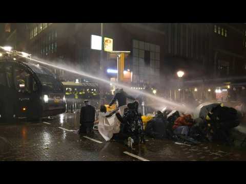 Dutch police use water cannon on Covid protesters