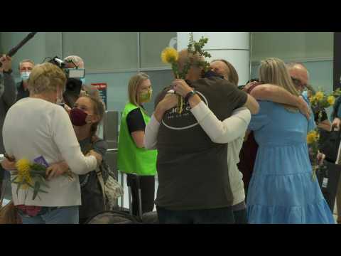 Emotional reunions at Sydney Airport as international border reopens