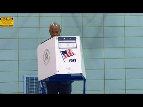 Black ex-cop Adams casts his vote in New York