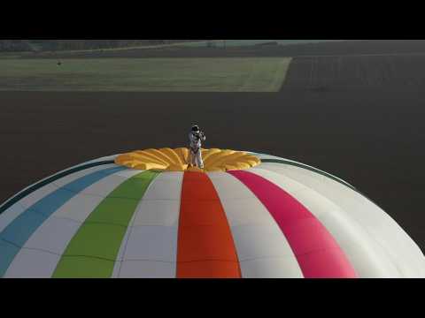 Frenchman breaks world record for standing on top of hot air balloon at altitude